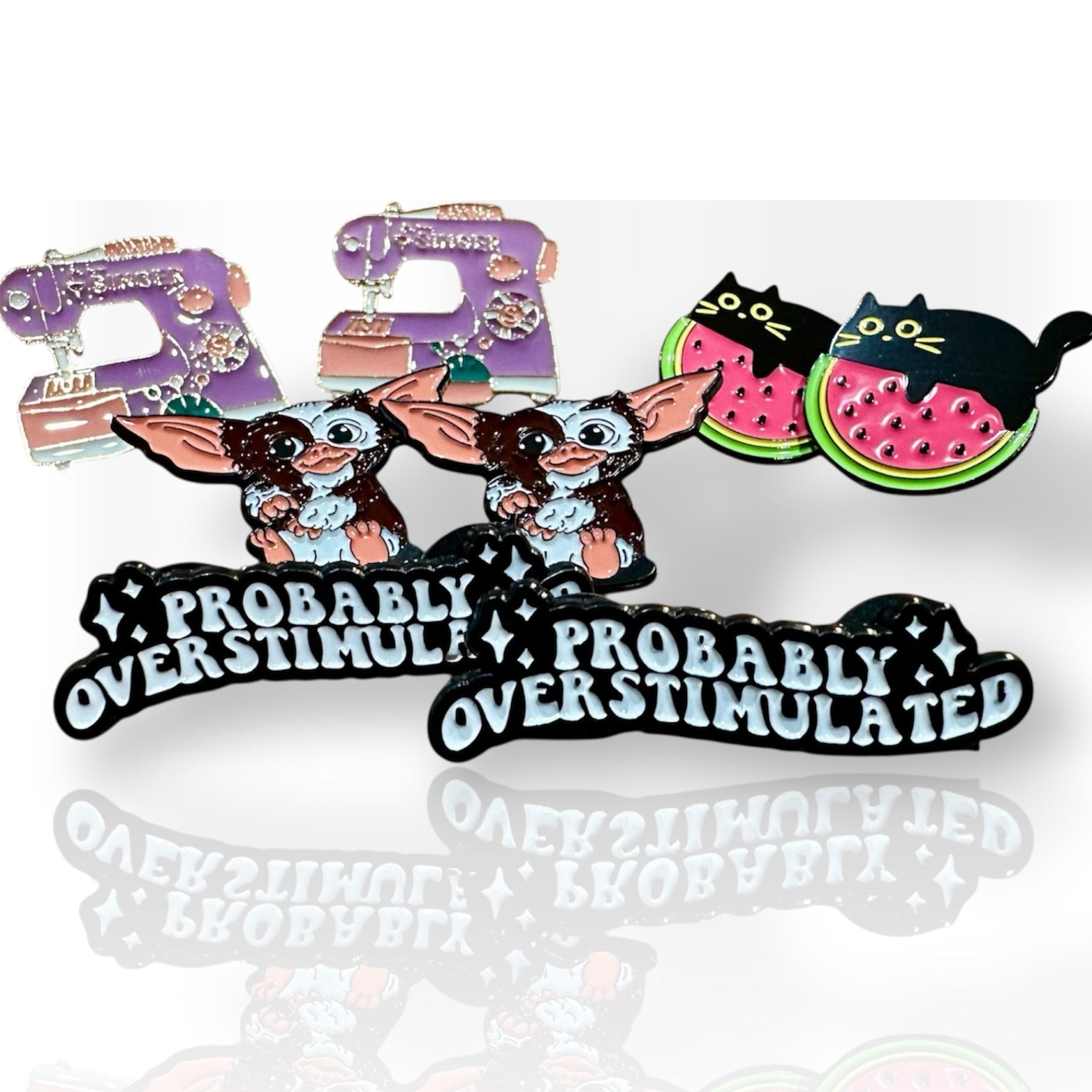 Set of pins featuring characters and text on a white background